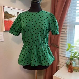 Green and black polka dot peplum top